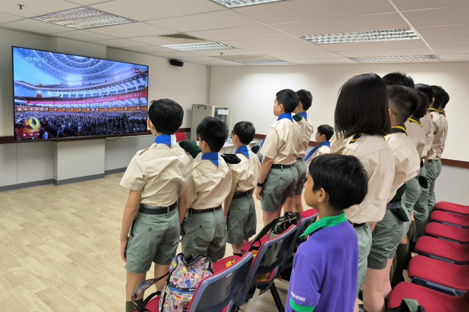 Members of the Scout Association of Hong Kong watching the live broadcast of the Grand Assembly marking the 105th Anniversary of the founding of the Communist Party of China